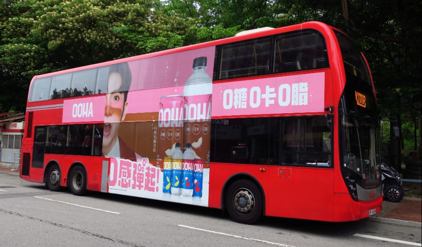Red bus with advertising graphics
