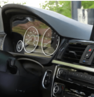 Car interior dashboard showing instrument cluster and center console
