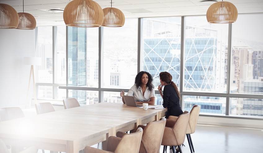 woman discussing on table
